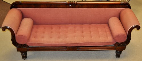 Lot 1343 - A late Regency mahogany sofa, with carved rail...