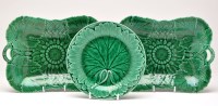 Lot 390 - Composite set of thirteen green-glazed plates...