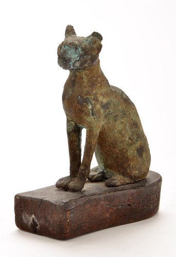 Lot 450 - Egyptian bronze hollow cat, sitting in an...