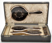 Lot 529 - A George V five-piece silver and tortoiseshell...