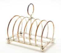 Lot 551 - A George V seven bar toast rack, by Atkin Bros....