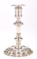 Lot 638 - A George II cast candlestick, by James Gould,...