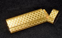 Lot 663 - A gold-plated lighter by Cartier, Paris.