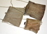 Lot 676 - Three white metal chain mail evening purses,...