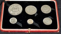 Lot 712 - A George V specimen set of six silver coins,...