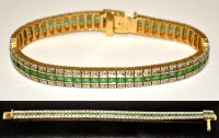Lot 744 - An emerald and diamond bracelet, set with...