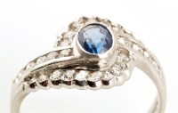 Lot 754 - A sapphire and diamond dress ring, the oval...