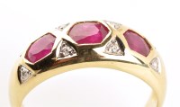 Lot 755 - A ruby and diamond ring, each of the three...