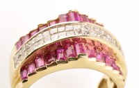 Lot 756 - A ruby and diamond ring, the central band set...