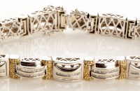 Lot 758 - A yellow and white diamond bracelet, the...