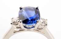 Lot 759 - A sapphire and diamond ring, the central oval...