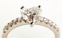 Lot 760 - A diamond ring, the central brilliant heart...