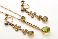 Lot 775 - An Edwardian peridot pendant, the canted...