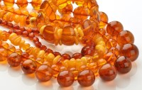 Lot 782 - Four amber bead necklaces, to include: one of...