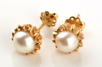 Lot 792 - A pair of cultured pearl stud earrings, each...