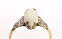 Lot 796 - An Art Deco opal and diamond ring, the central...