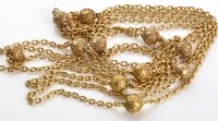 Lot 802 - A Victorian yellow metal muff chain, the cable...