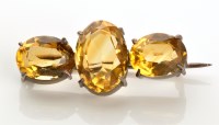 Lot 803 - A Victorian citrine brooch, the three...