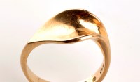 Lot 805 - A modern design Danish 14ct. yellow gold ring,...