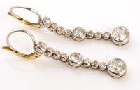 Lot 823 - A pair of diamond drop earrings, c.1900, set...