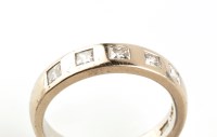 Lot 827 - A diamond and 18ct. white gold ring, set with...