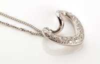 Lot 834 - A diamond set heart-shaped pendant, the...