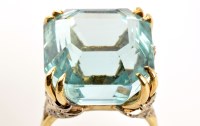 Lot 840 - An aquamarine and diamond ring, the central...