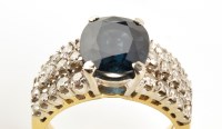 Lot 847 - A sapphire and diamond ring, the central oval...