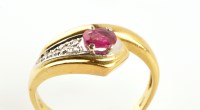 Lot 852 - A ruby and diamond snake pattern ring, set...