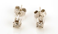 Lot 855 - A pair of diamond stud earring, the brilliant...