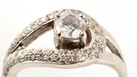 Lot 856 - A modern diamond ring, the central brilliant...