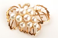 Lot 869 - A cultured pearl and yellow metal brooch, of...