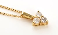 Lot 873 - A diamond drop pendant, set with three...