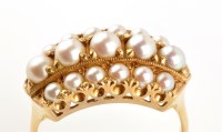 Lot 877 - A cultured pearl ring, the central row of five...