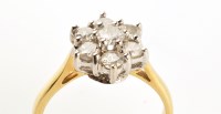 Lot 884 - A diamond cluster ring, set with seven...