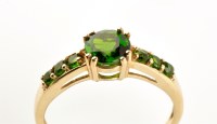 Lot 899 - A chrome diopside ring, the central circular...