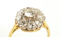 Lot 916 - A diamond cluster ring, the central brilliant...