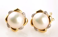 Lot 922 - A pair of mabe pearls, diamond and yellow...