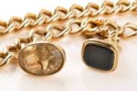 Lot 928 - A Victorian yellow metal bracelet, of curb...