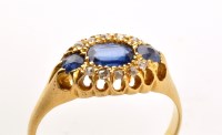 Lot 934 - A sapphire and diamond ring, the central oval...