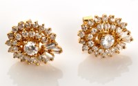 Lot 935 - A pair of diamond cluster stud earrings, set...