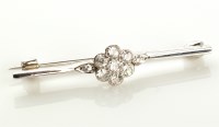 Lot 947 - A diamond cluster bar brooch, set with seven...