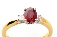 Lot 948 - A ruby and diamond ring, the central oval...