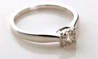 Lot 953 - A diamond cluster ring, the central brilliant...