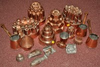 Lot 986 - A collection of copper jelly moulds and other...