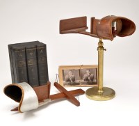 Lot 1003 - A collection of stereo scope viewers and...