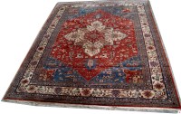 Lot 1057 - A late 20th Century Heriz style carpet,...
