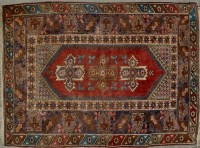 Lot 1060 - A modern Turkish rug, with triple medallion to...