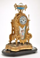 Lot 1091 - A French ormolu mantel clock, with porcelain...