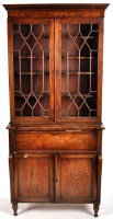 Lot 1112 - A George IV mahogany secretaire cabinet, the...